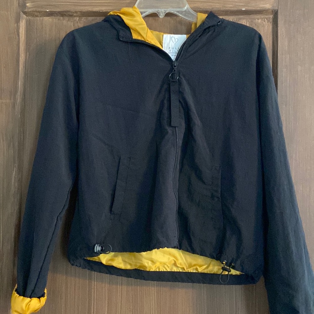 Girls size large wind breaker. Rarely worn.